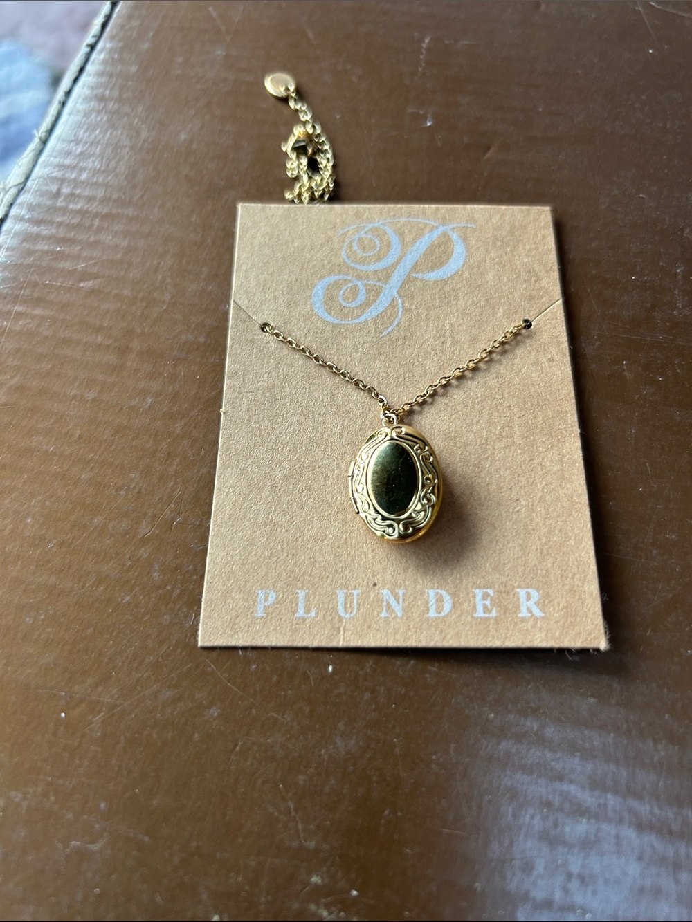 Plunder Gold Oval Locket Necklace with Black Center